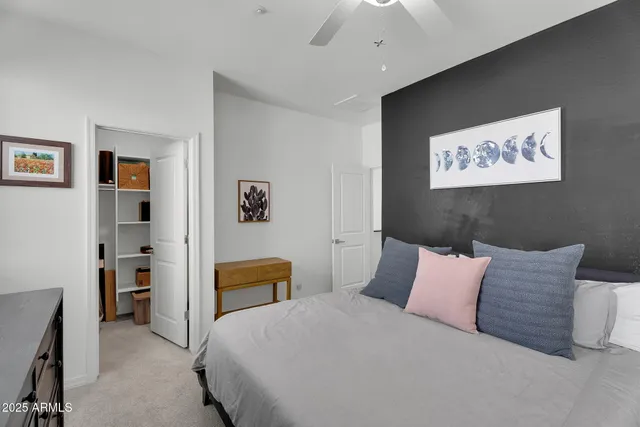 a bedroom with a bed and a couch