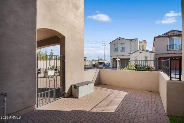 a view of roof deck with couches and sky view