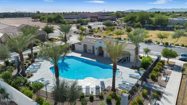 an aerial view of residential houses with outdoor space and lake view