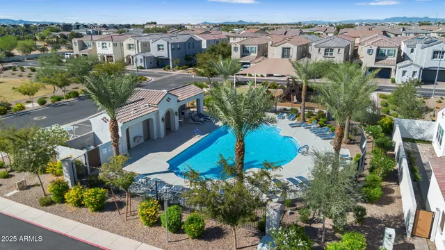 an aerial view of multiple houses with yard