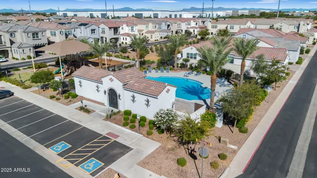 an aerial view of residential houses with outdoor space