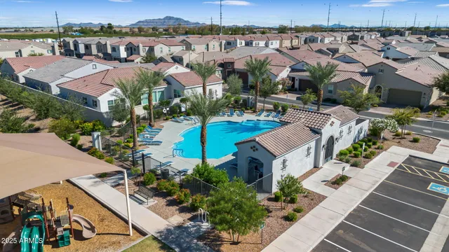 an aerial view of a house with a yard patio and lake view