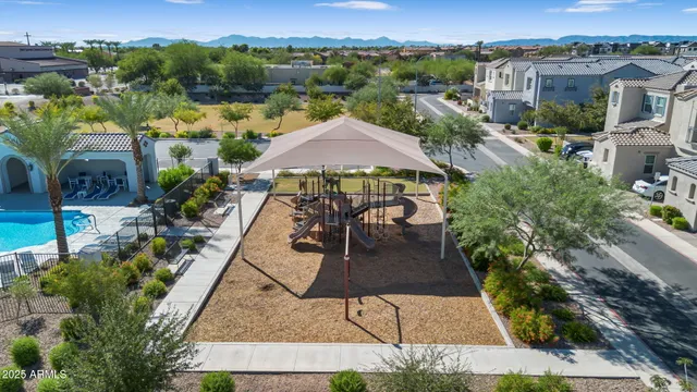 an aerial view of a house with yard swimming pool and outdoor seating