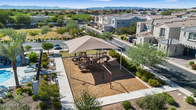 an aerial view of a house with yard and lake view