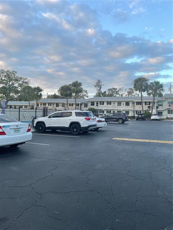 14531 Walsingham Road, Unit 203 Largo, FL 33774 - Photo 24 of 24 a cars parked in a parking lot