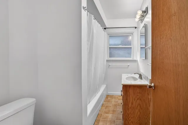 a bathroom with a sink and toilet