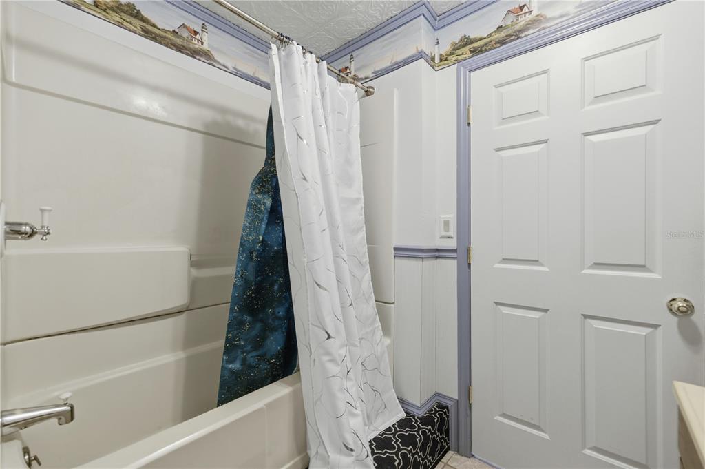 9151 Southwest 157th Lane Dunnellon, FL 34432 - Photo 13 of 63 a bathroom with a shower and a tub