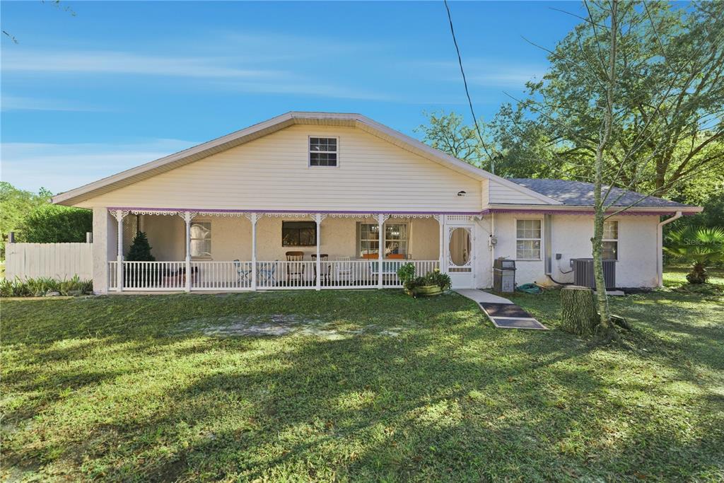 9151 Southwest 157th Lane Dunnellon, FL 34432 - Photo 27 of 63 a view of a house with a yard and sitting area