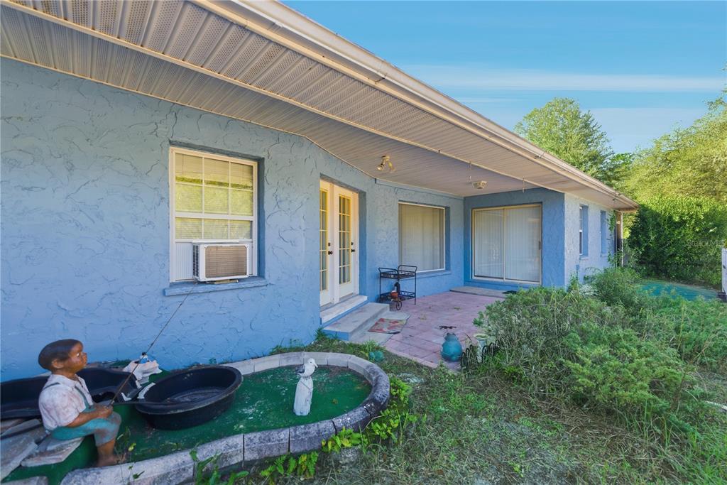 9151 Southwest 157th Lane Dunnellon, FL 34432 - Photo 30 of 63 a backyard of a house with outdoor seating