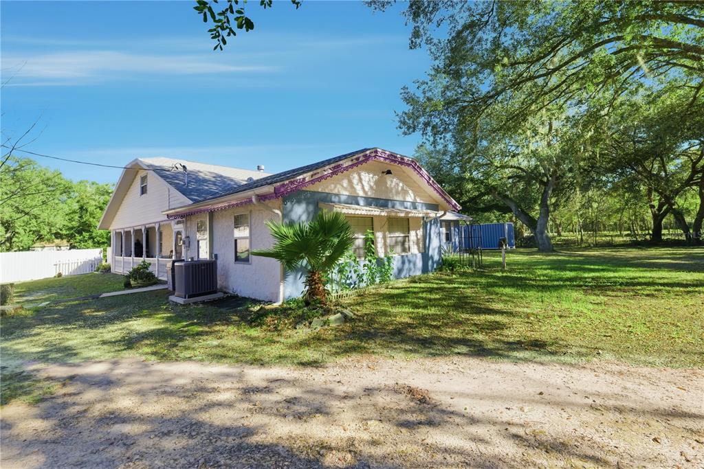 9151 Southwest 157th Lane Dunnellon, FL 34432 - Photo 33 of 63 a front view of a house with a yard