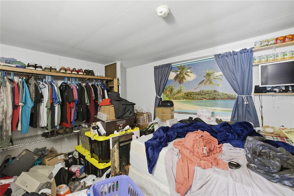 9151 Southwest 157th Lane Dunnellon, FL 34432 - Photo 50 of 63 a view of walk in closet with clothes and shoes