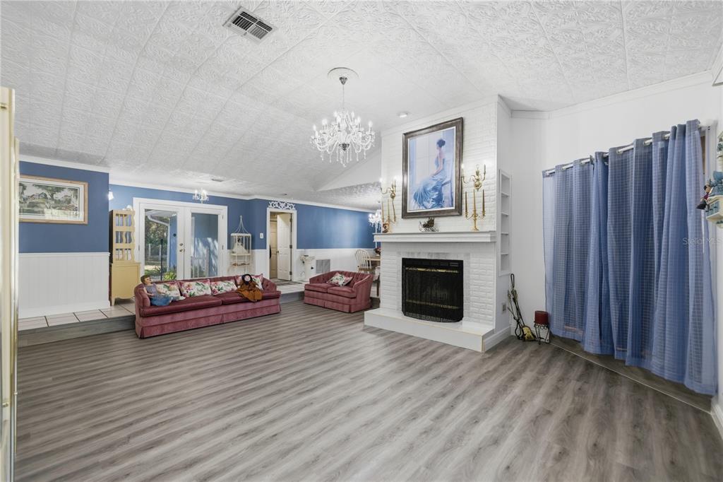 9151 Southwest 157th Lane Dunnellon, FL 34432 - Photo 6 of 63 a living room with furniture and a fireplace