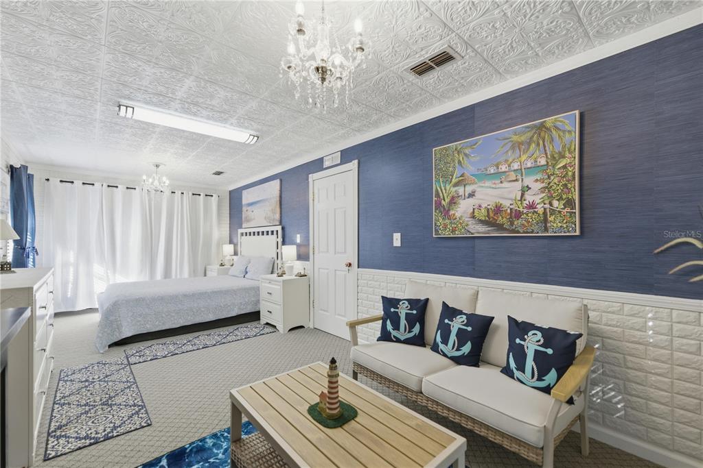 9151 Southwest 157th Lane Dunnellon, FL 34432 - Photo 8 of 63 a living room with furniture and a chandelier