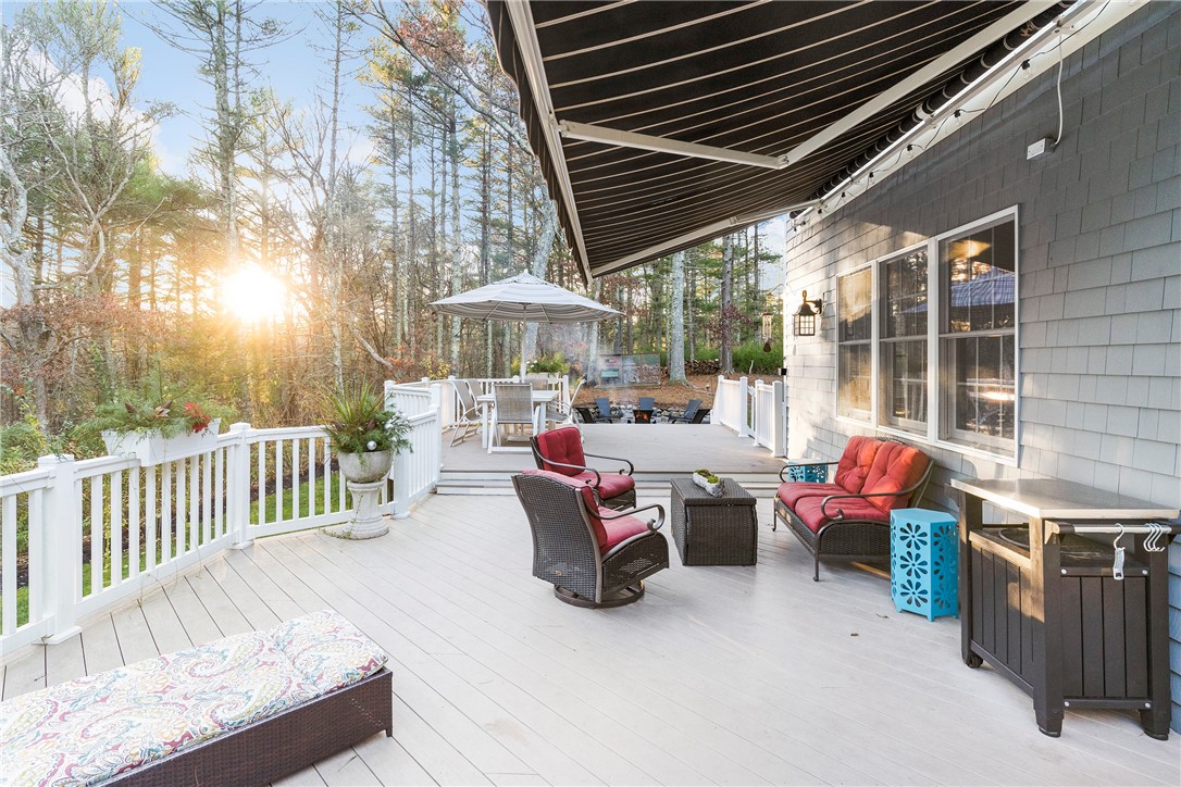119 Locust Valley Road Exeter, RI 02822 - Photo 38 of 50 New double tiered, composite decking and electronic retractable awning.