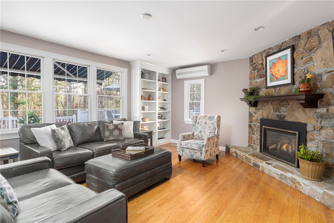 119 Locust Valley Road Exeter, RI 02822 - Photo 8 of 50 Custom shelving, stone fireplace with new Gas Fireplace