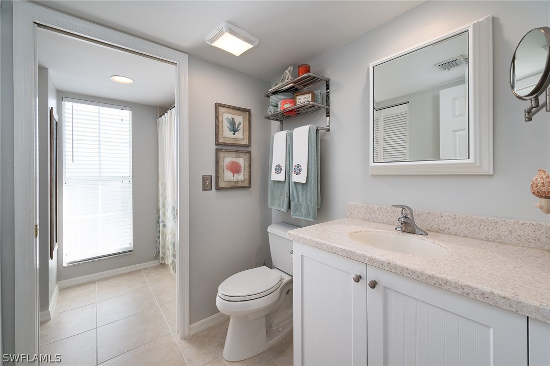 14979 Rivers Edge Court, Unit 223 Fort Myers, FL 33908 - Photo 11 of 21 a bathroom with a sink a toilet and shower