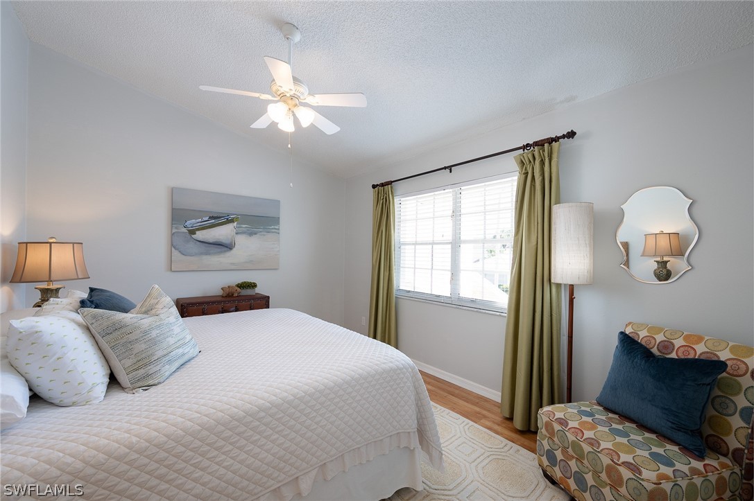 14979 Rivers Edge Court, Unit 223 Fort Myers, FL 33908 - Photo 10 of 21 a bedroom with a bed and window