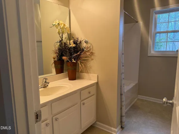 a bathroom with a sink a vanity and a mirror
