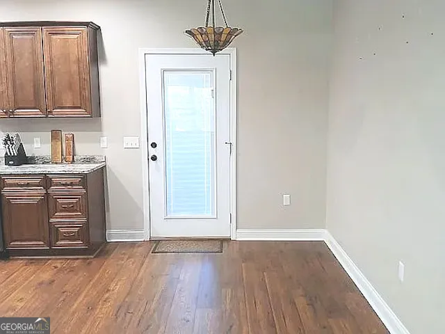 a kitchen with a sink cabinets and window