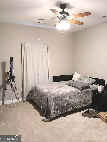 a view of a livingroom with wooden floor