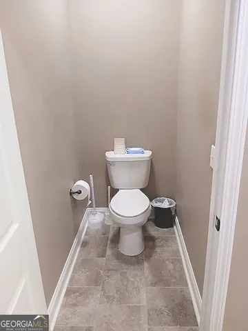 a bathroom with a tub shower and a sink