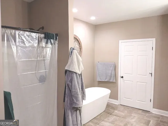 a white bath tub sitting in a bathroom
