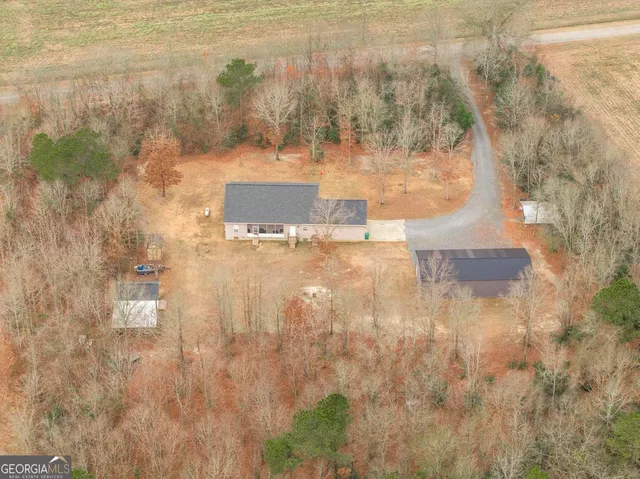 an aerial view of residential house with outdoor space