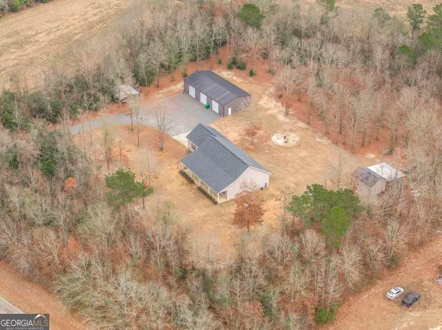 a view of a yard with large trees