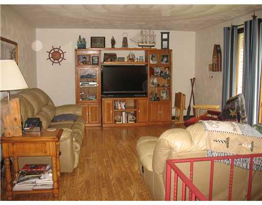 560 Ekastown Road Sarver, PA 16055 - Photo 2 of 9 Living Room. Plaster walls and laminate floor.
