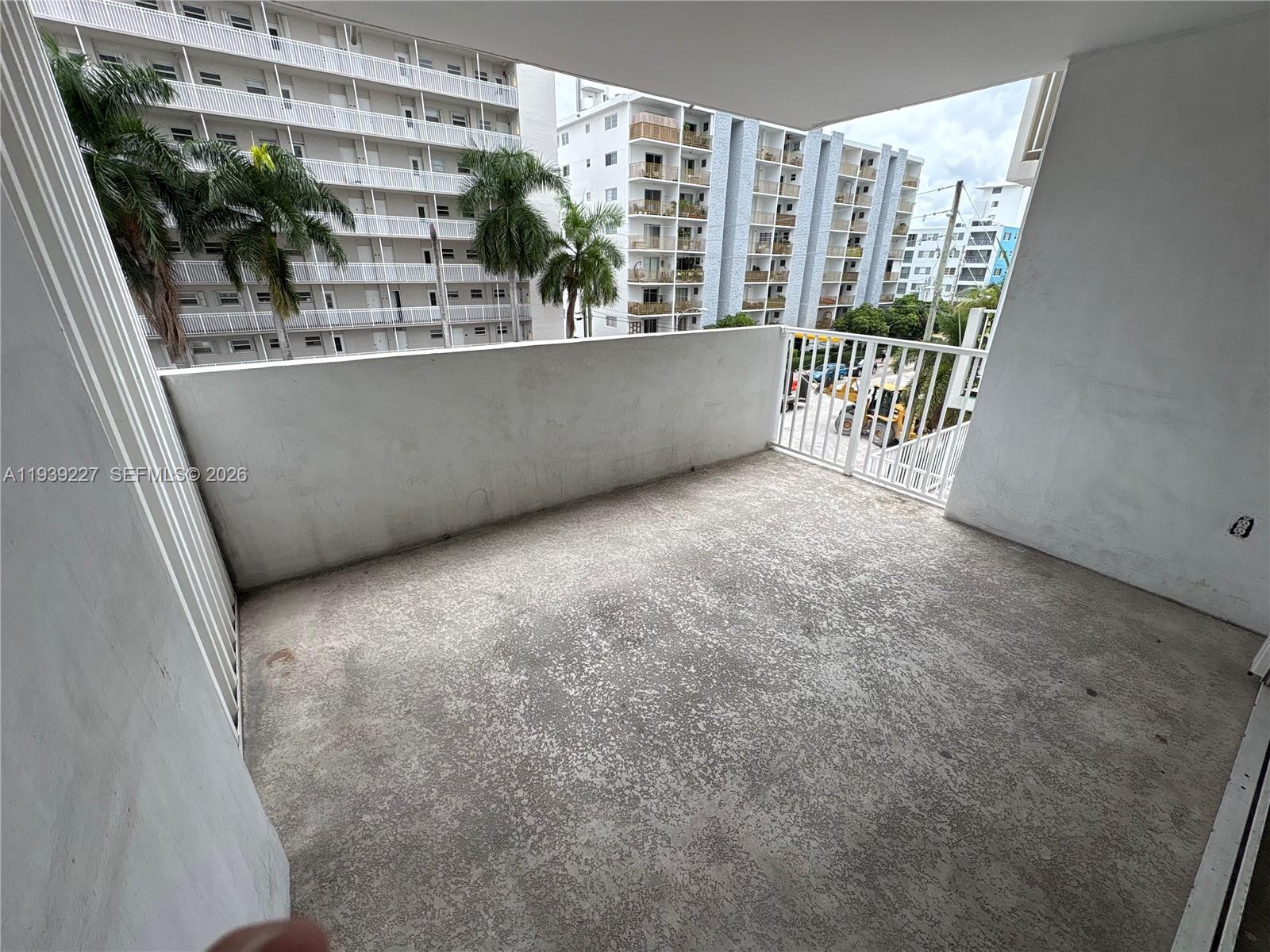 1331 Lincoln Road, Unit 402 Miami Beach, FL 33139 - Photo 11 of 20 a view of a living room and a porch