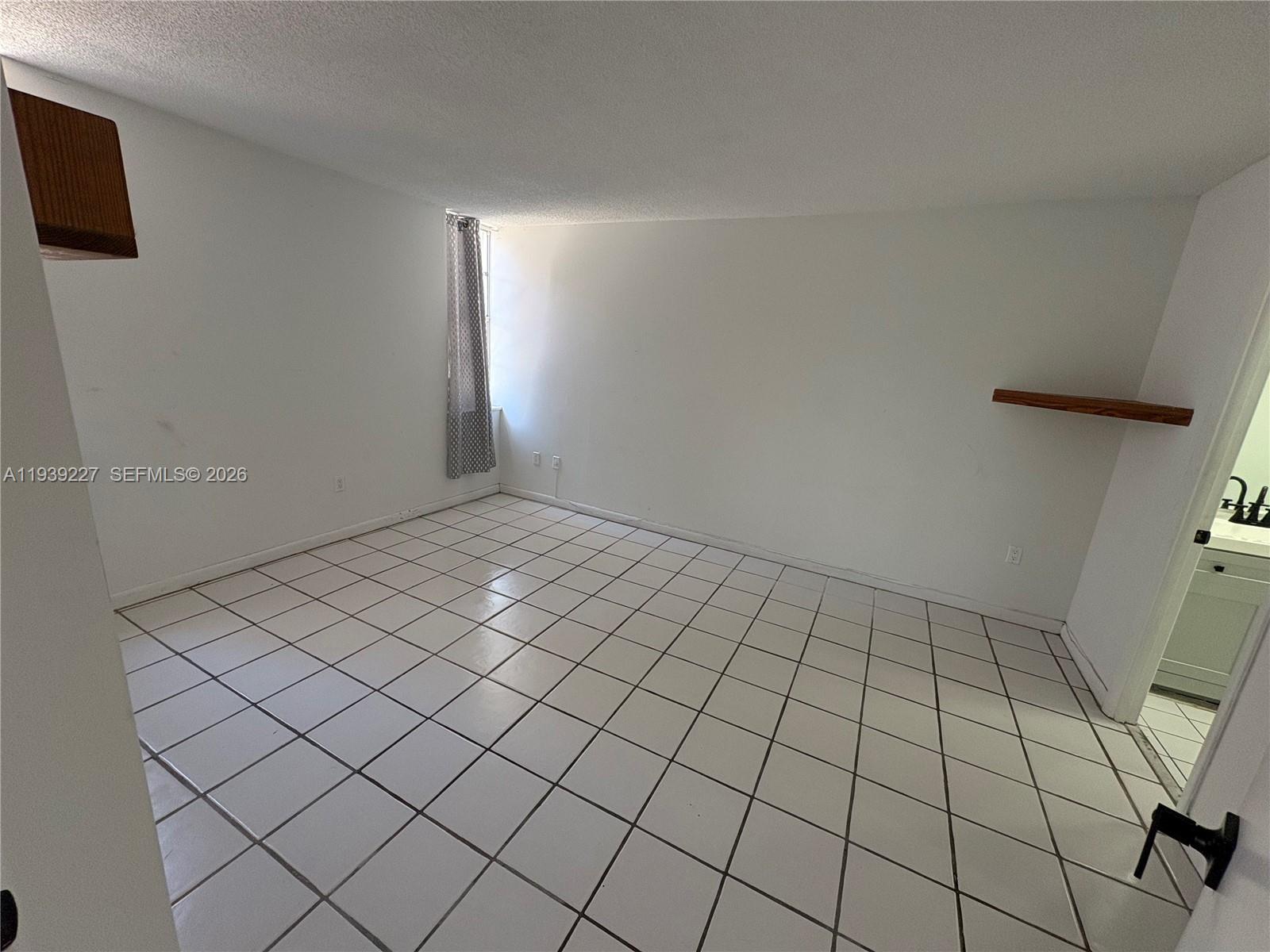 1331 Lincoln Road, Unit 402 Miami Beach, FL 33139 - Photo 12 of 20 a view of an empty room and a window