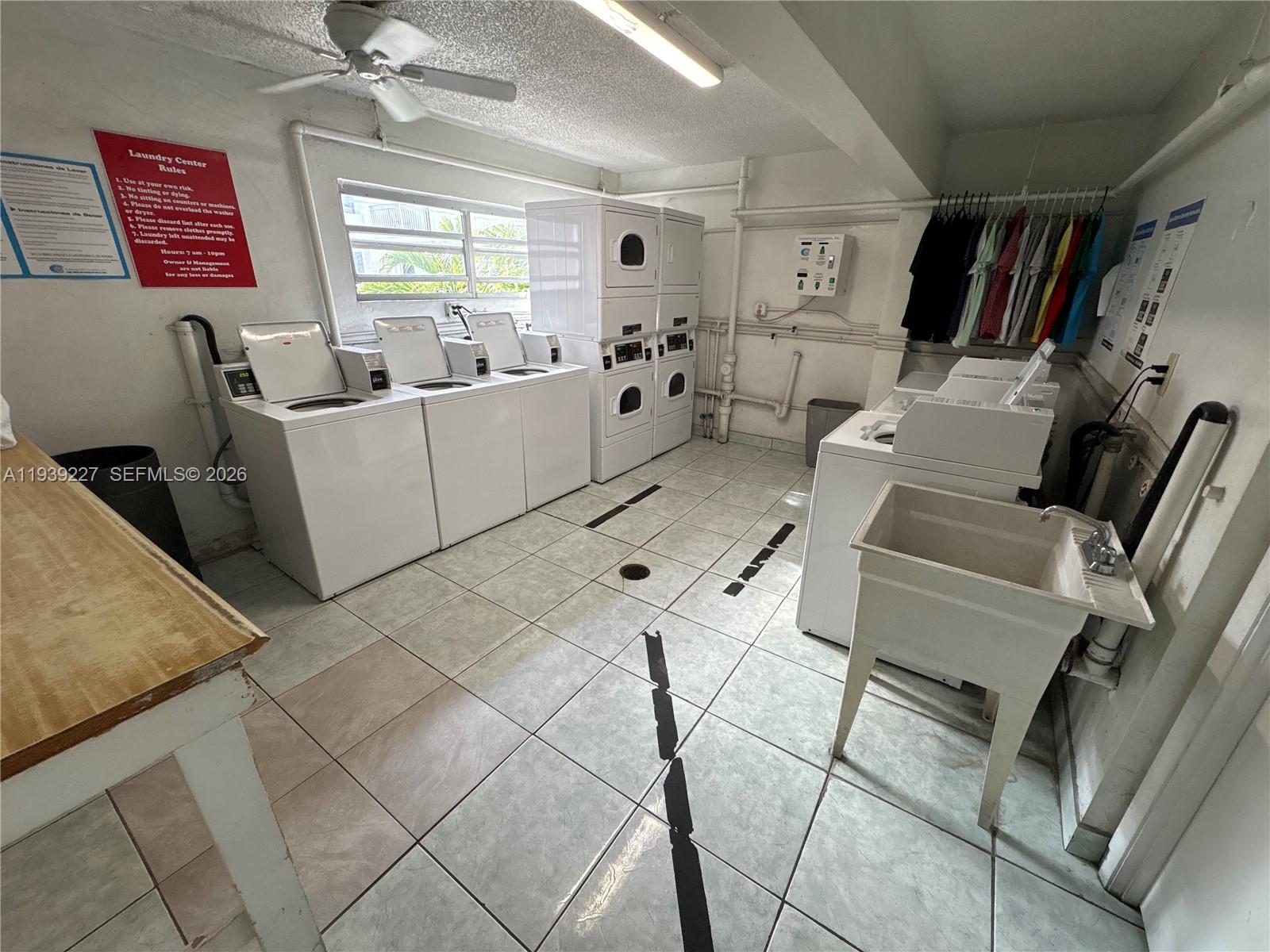 1331 Lincoln Road, Unit 402 Miami Beach, FL 33139 - Photo 18 of 20 a living room with furniture and a flat screen tv