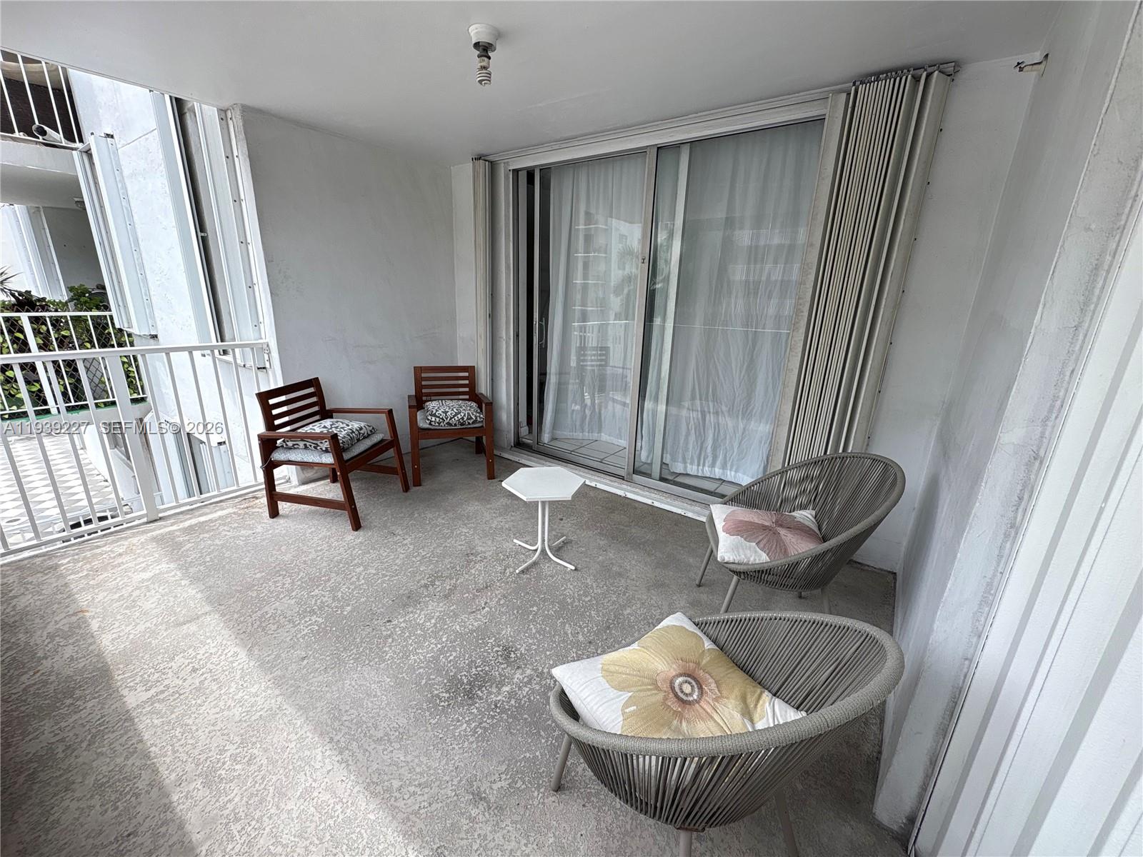 1331 Lincoln Road, Unit 402 Miami Beach, FL 33139 - Photo 10 of 20 a living room with furniture and a potted plant