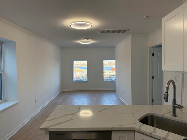 a view of a kitchen with a sink cabinets and a window