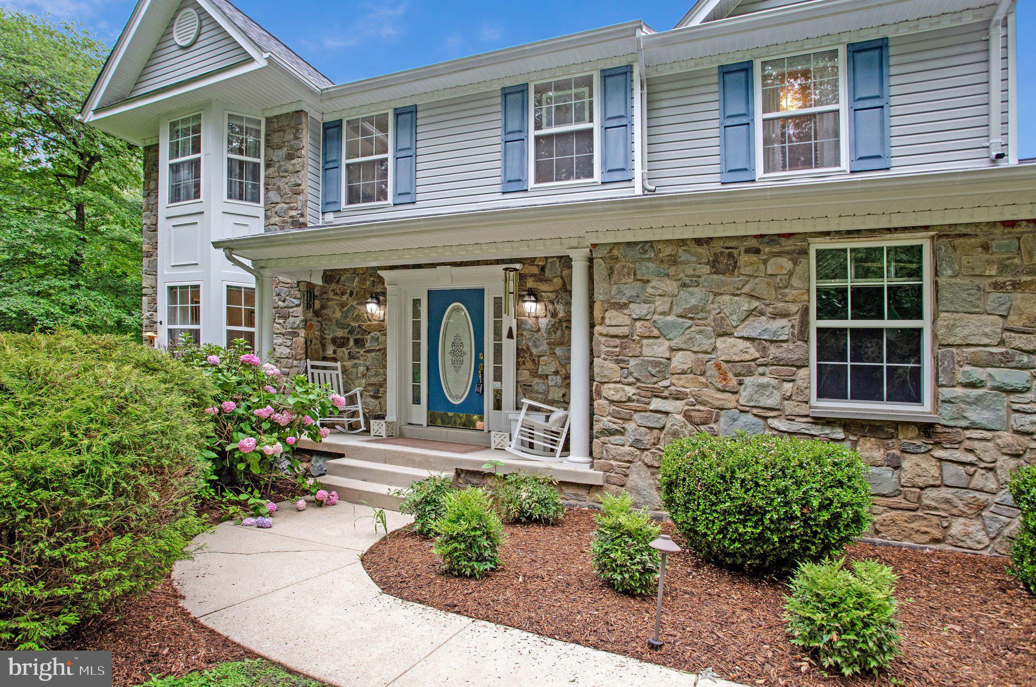 1582 Snug Harbor Road Shady Side, MD 20764 - Photo 4 of 53 Charming stone-front home with lush greenery.