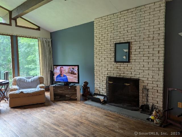 35 Sturbridge Road Easton, CT 06612 - Photo 15 of 23 a living room with furniture a flat screen tv and a fireplace