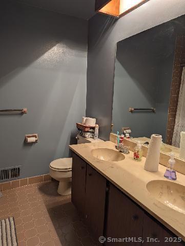 35 Sturbridge Road Easton, CT 06612 - Photo 17 of 23 a bathroom with a sink and a toilet