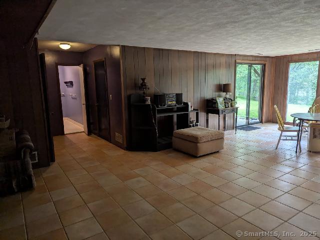 35 Sturbridge Road Easton, CT 06612 - Photo 20 of 23 a living room with furniture and a floor to ceiling window