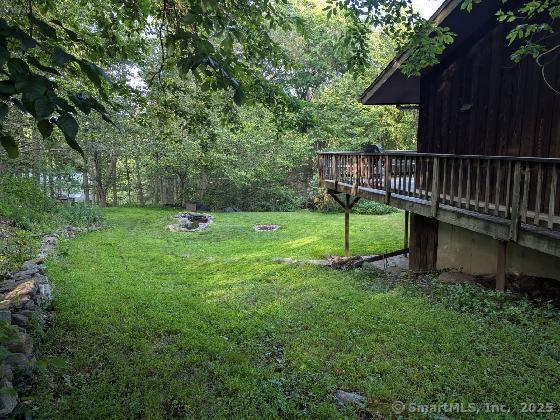 35 Sturbridge Road Easton, CT 06612 - Photo 4 of 23 a view of a chair and table and wooden fence