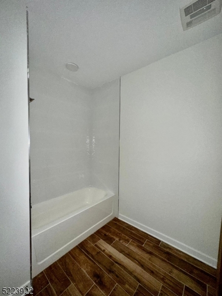 321 East 3rd Street, Unit 210 Plainfield, NJ 07060 - Photo 16 of 21 a bathroom with a bathtub