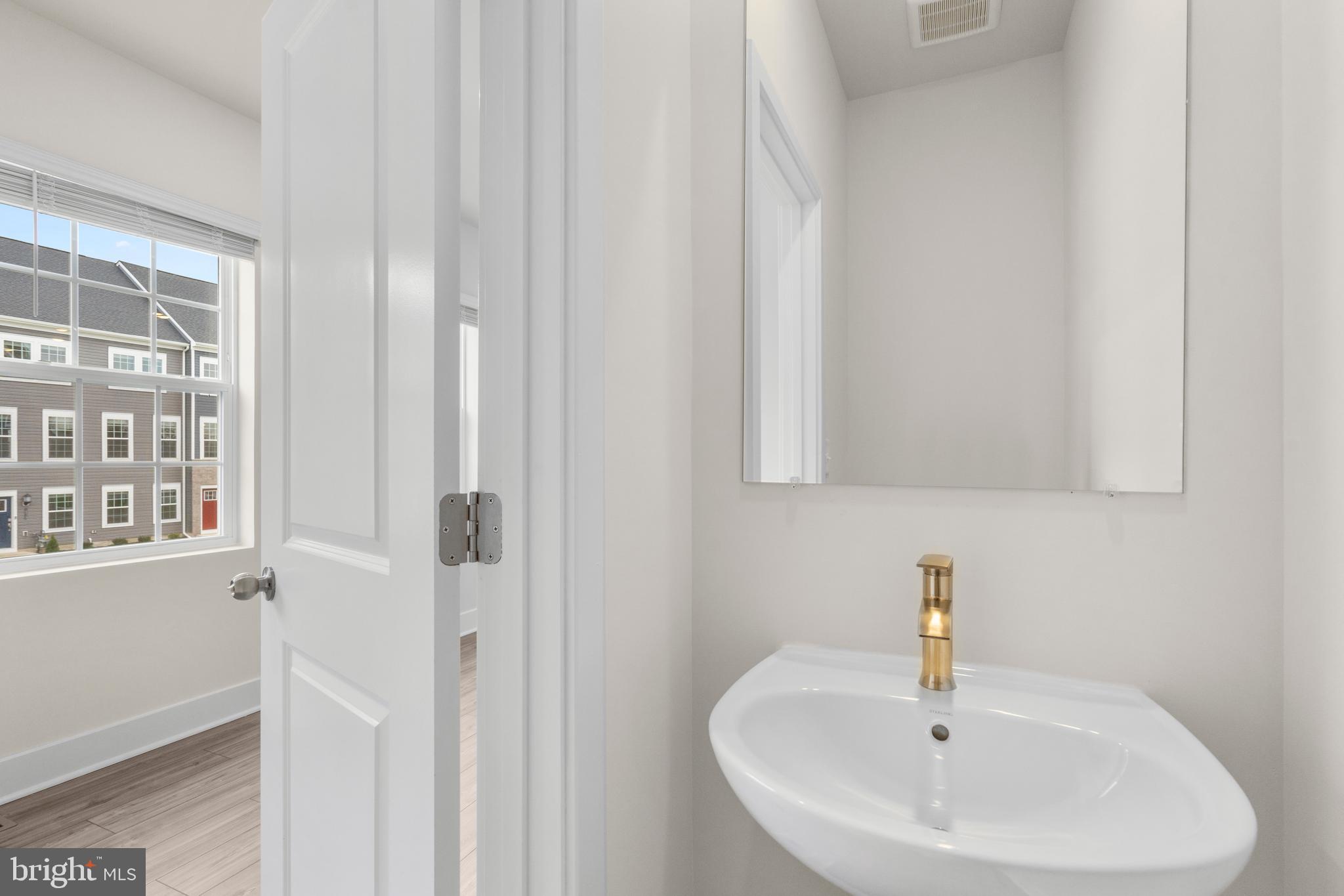 1826 Parham Way Windsor Mill, MD 21244 - Photo 18 of 37 a bathroom with a sink and a window
