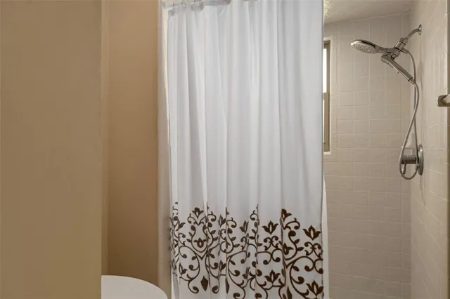 a bathroom with a shower curtain
