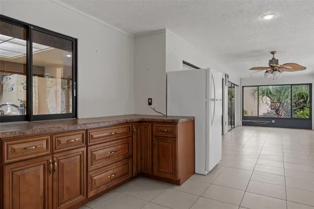 a kitchen with granite countertop a cabinets and steel appliances