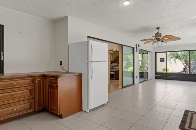 a kitchen with a refrigerator and countertop