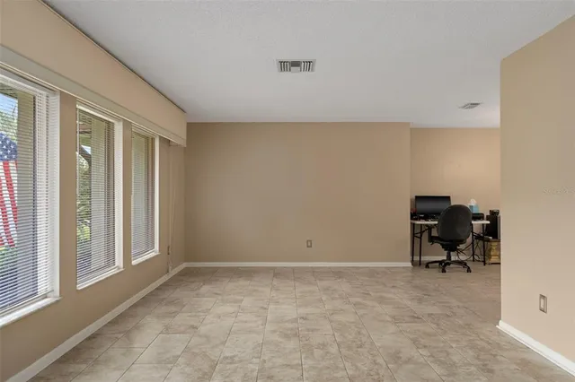 a view of workspace with furniture and a window