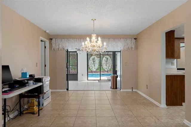 a view of a room with chandelier and windows
