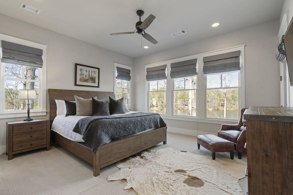 72 Buckeye Ridge Newnan, GA 30263 - Photo 27 of 80 a spacious bedroom with a bed and glass window