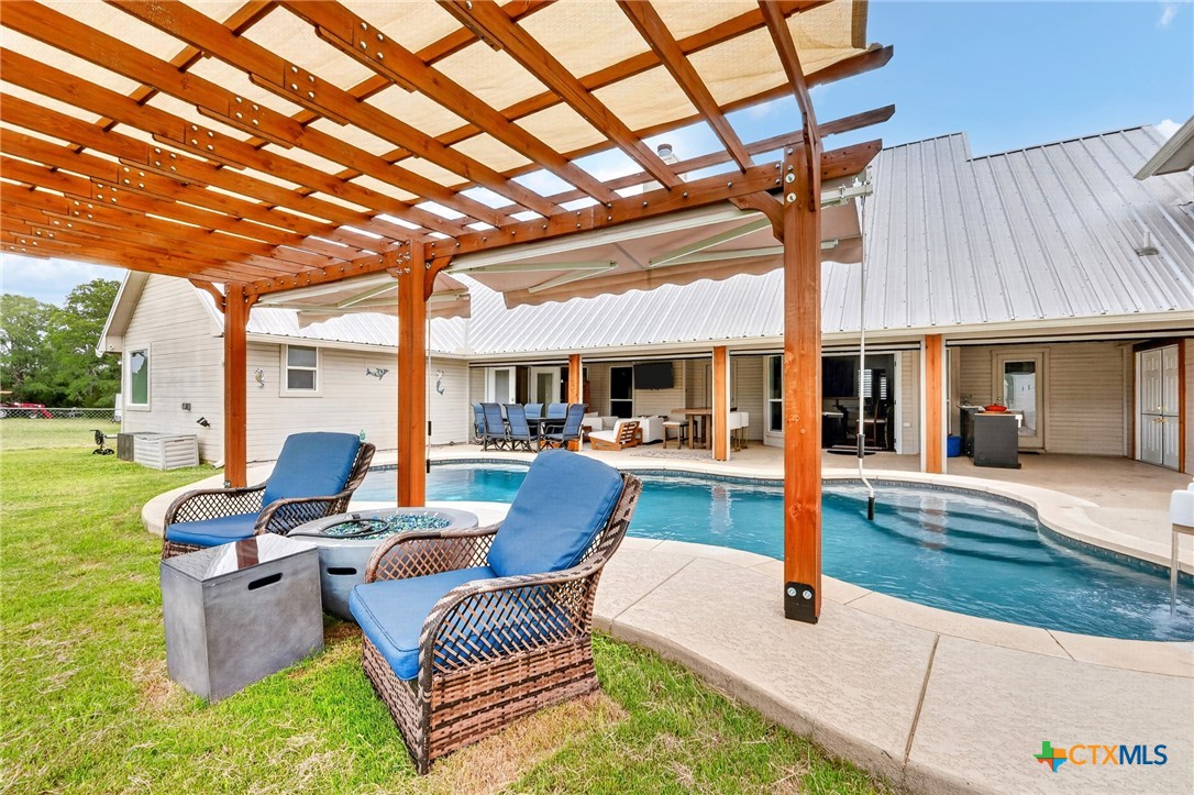 421 Sunset Ridge Drive Killeen, TX 76549 - Photo 46 of 47 a view of a patio with couches table and chairs with wooden floor and fence