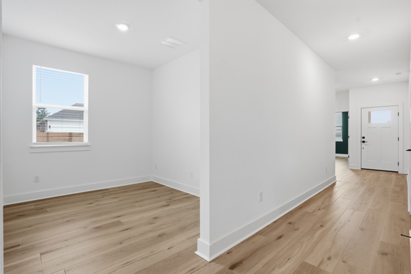 201 Prodigal Way Kyle, TX 78640 - Photo 10 of 22 Inviting interior with light-colored flooring, white walls, and recessed lighting