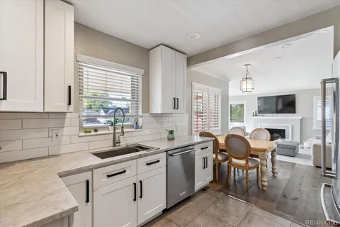 a kitchen with cabinets a sink and a stove top oven